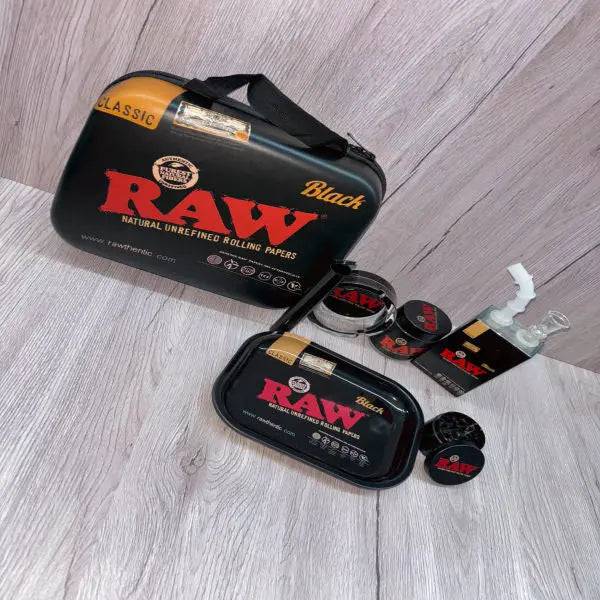 Black Raw 6-in-1 Juice Bong gift set from Certified Puffs featuring multiple attachments and accessories for versatile use.